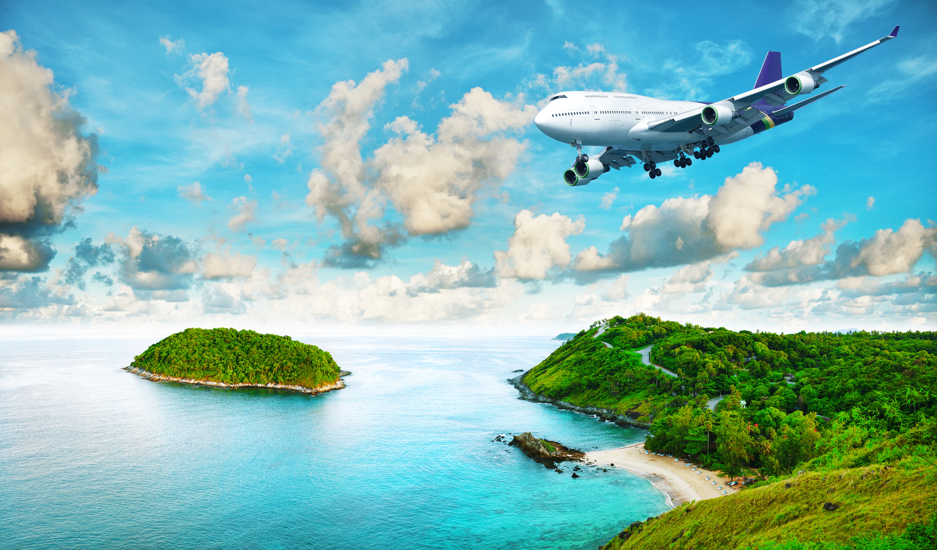 Jet liner over the tropical island. Panoramic composition in ver